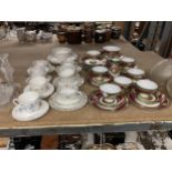 A LARGE QUANTITY OF VINTAGE CHINA CUPS, SAUCERS, SIDE PLATES PLUS SUGAR BOWLS AND A CREAM JUG, TO