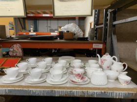 A PART ROYAL SUTHERLAND PART TEASET TO INCLUDE A COFFEEPOT TOGETHER WITH A FURTHER WHITE TEASET