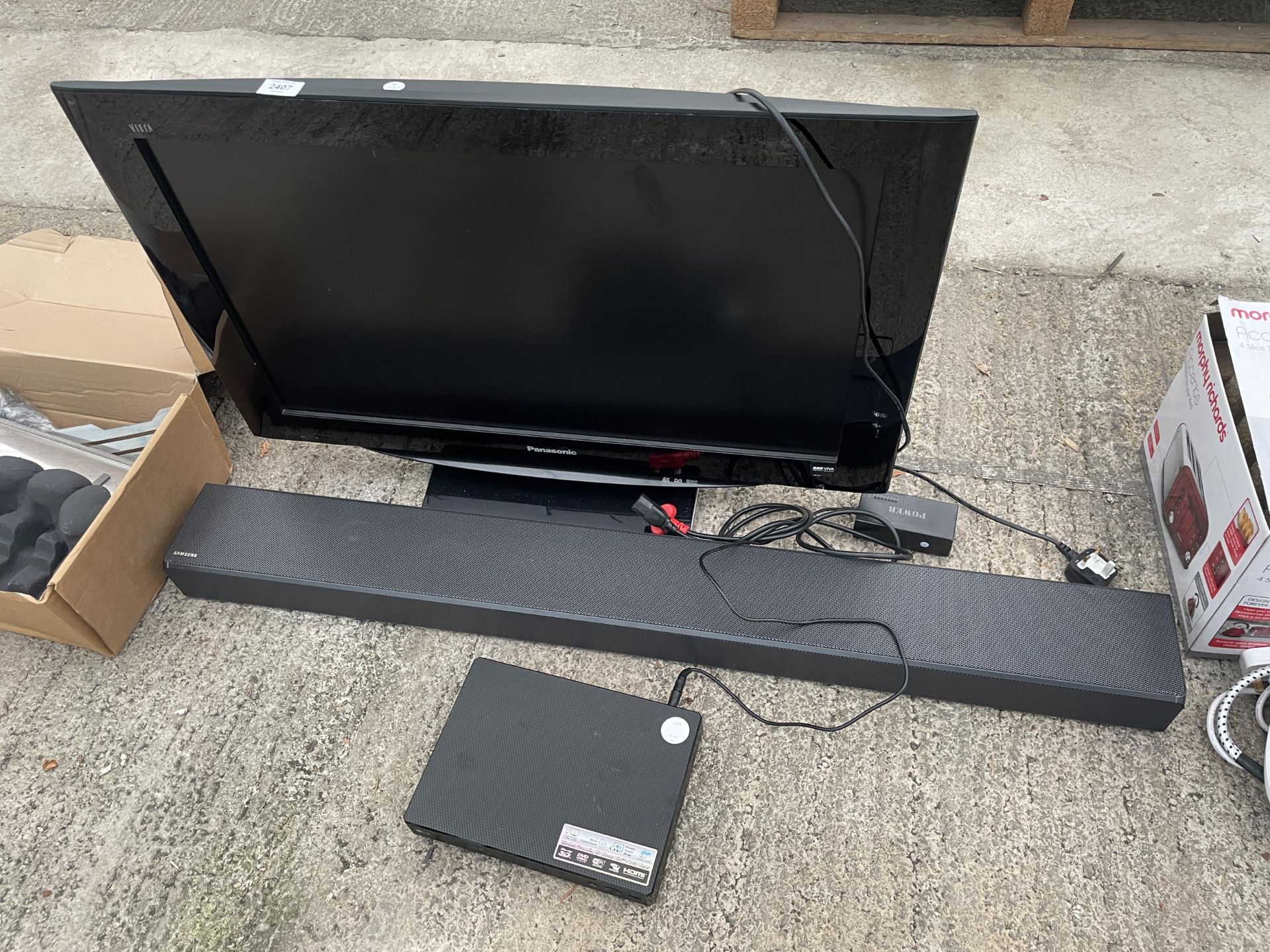 A PANASONIC 32" TELEVISION, A SAMSUNG SOUND BAR AND AN LG DVD PLAYER