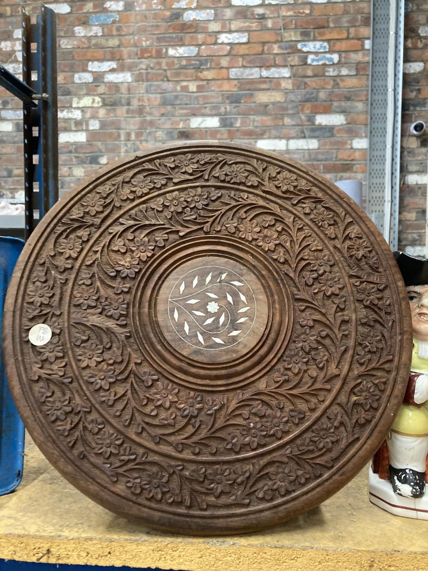 A SMALL HEAVILY CARVED ASIAN STYLE TABLE WITH THREE LEGS, HEIGHT 38CM, DIAMETER 37CM - Image 2 of 2