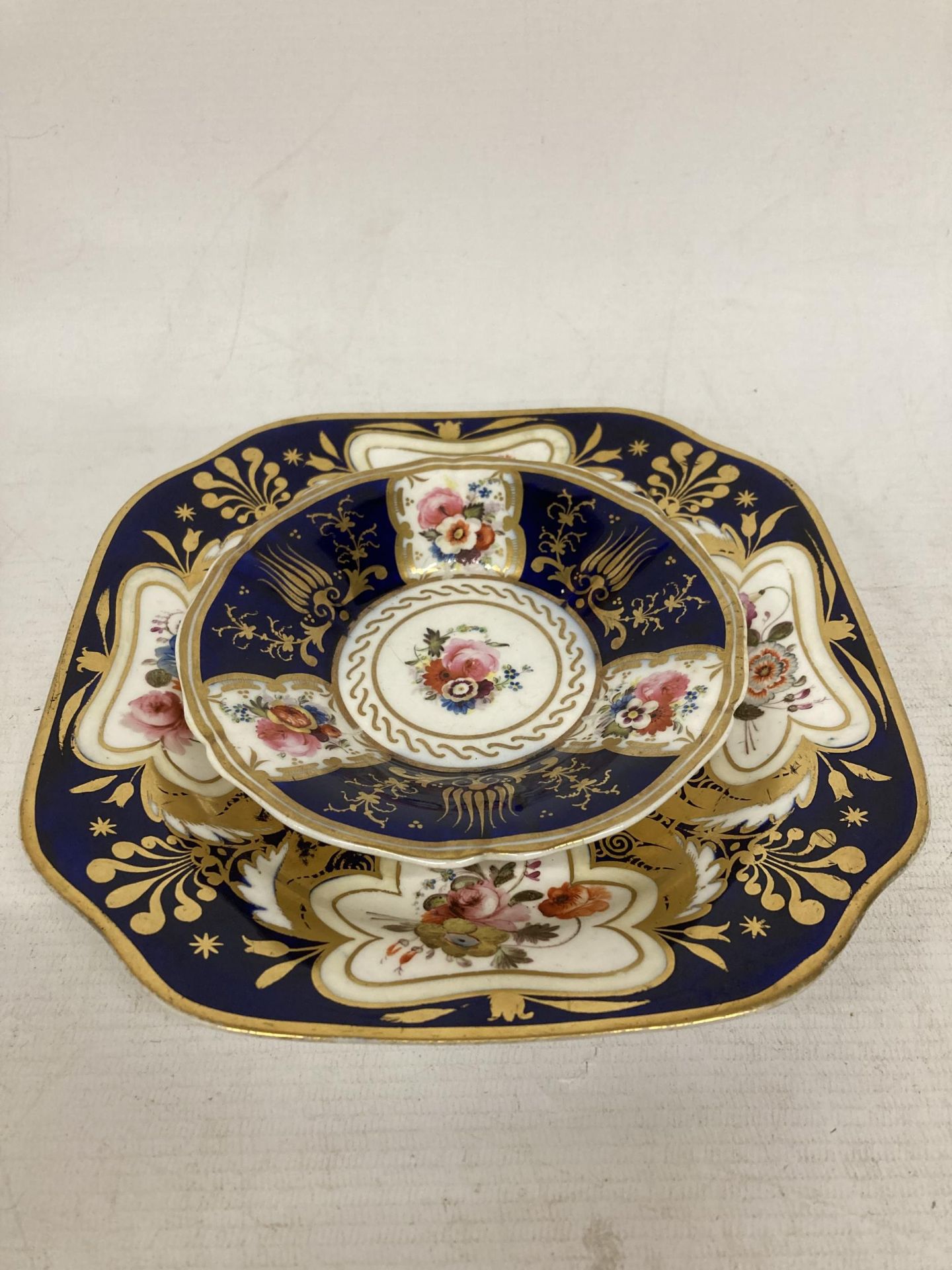 A 19TH CENTURY COBALT BLUE, GILT AND HAND PAINTED FLORAL CUP, SAUCER AND SIDE PLATE TRIO - Image 2 of 4