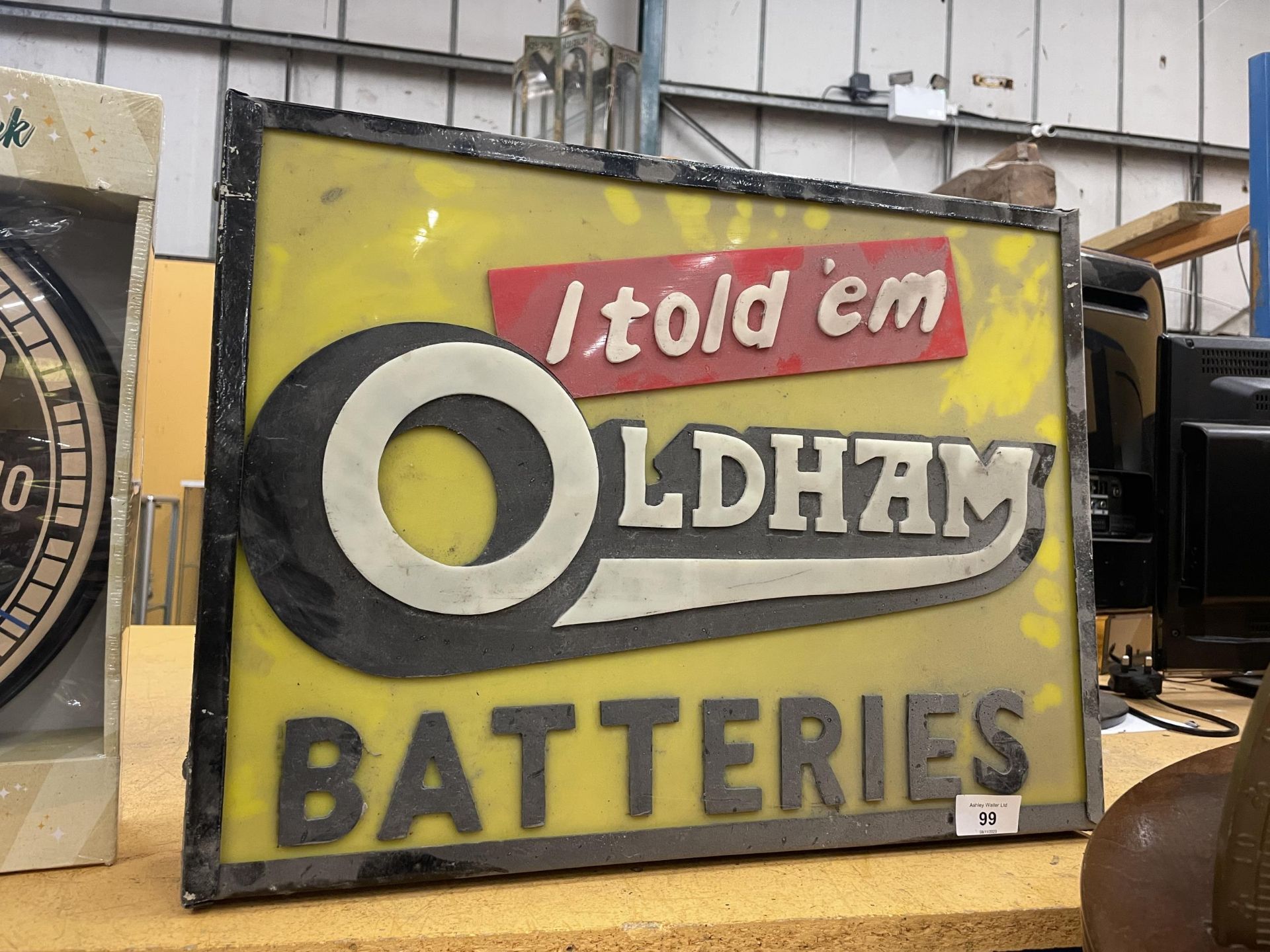 AN OLDHAM BATTERIES 'I TOLD 'EM' ILLUMINATED BOX SIGN