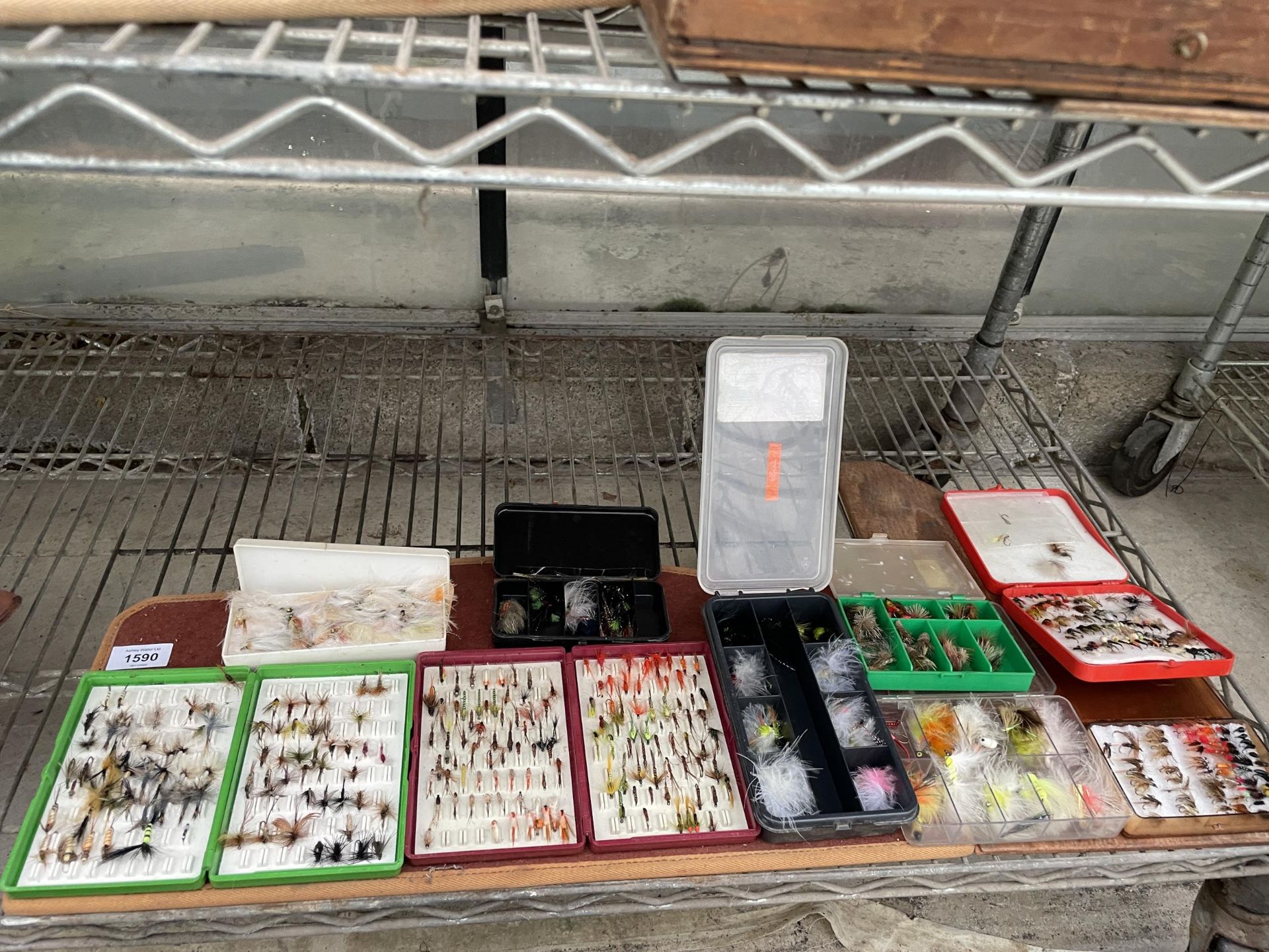 A LARGE ASSORTMENT OF CASED FISHING FLIES