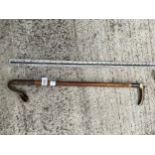 A VINTAGE RIDING CROP WITH BONE HANDLE AND HALLMARKED SILVER COLLAR