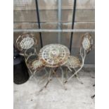 A VINTAGE FOLDING METAL BISTRO TABLE AND TWO CHAIRS