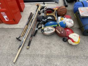 AN ASSORTMENT OF SPORTS EQUIPMENT TO INCLUDE BALLS, RACKETS AND HOCKEY STICKS ETC