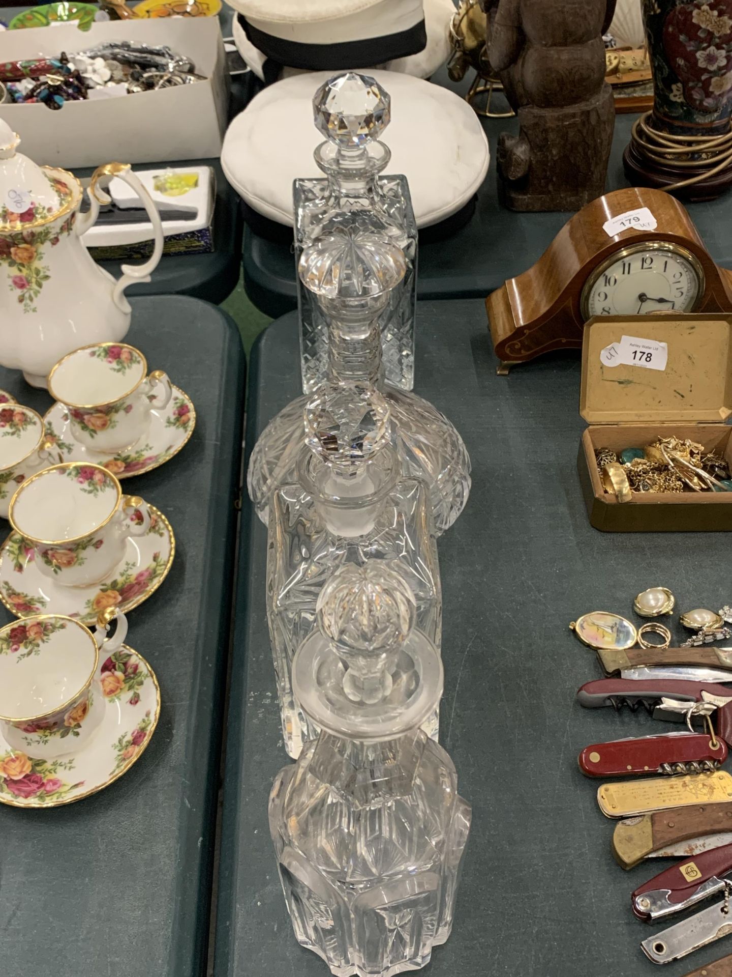 A GROUP OF FOUR CUT GLASS DECANTERS