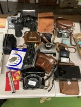 A COLLECTION OF VINTAGE CAMERAS TO INCLUDE HALINA PAULETTE ELECTRIC, KODAK, ADOX, POLAROID EZ1800