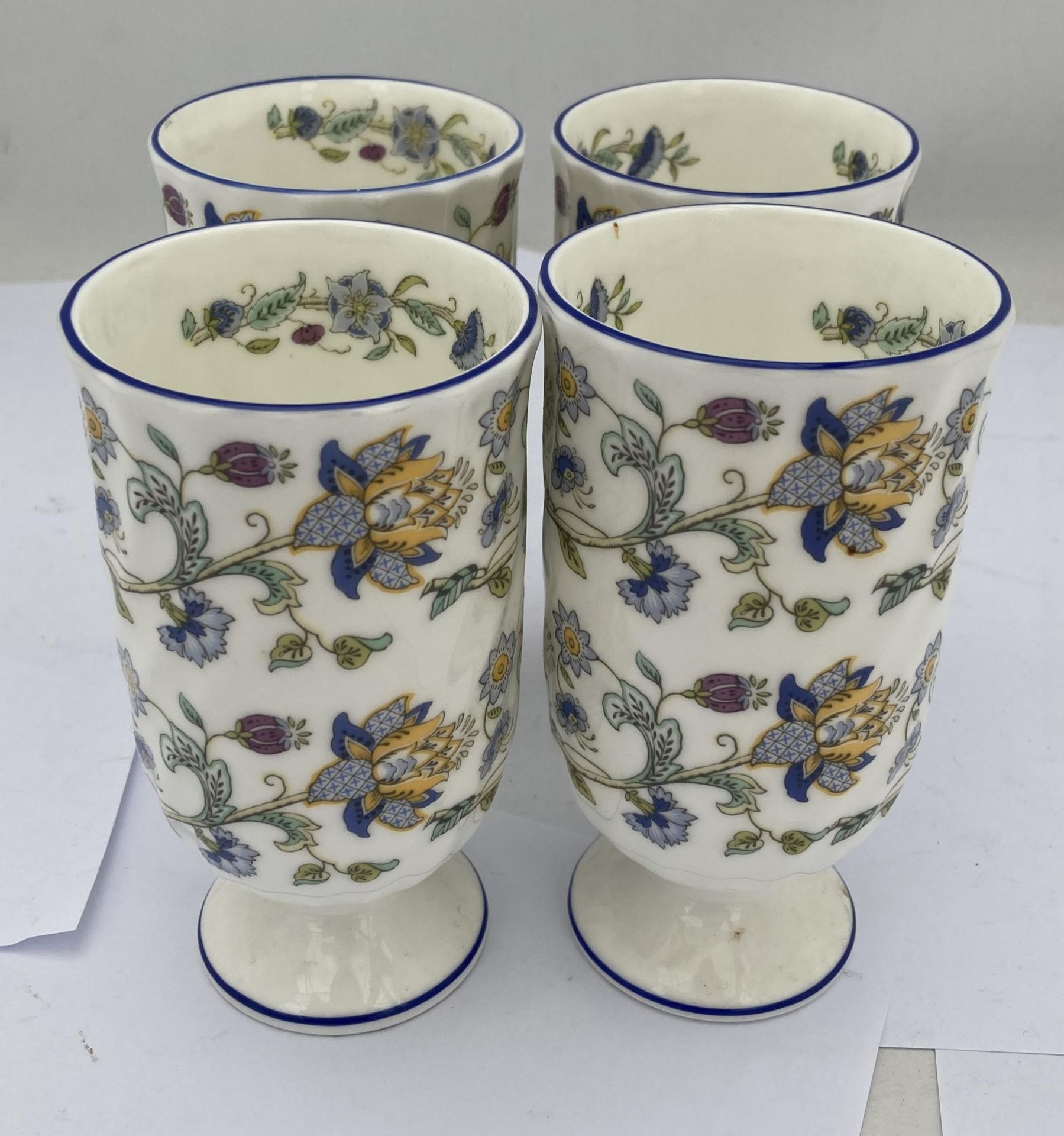 A SET OF FOUR MINTON HADDON HALL BLUE GOBLET CUPS