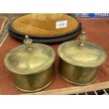 A PAIR OF BRASS INK WELLS WITH GLASS LINERS