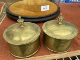 A PAIR OF BRASS INK WELLS WITH GLASS LINERS