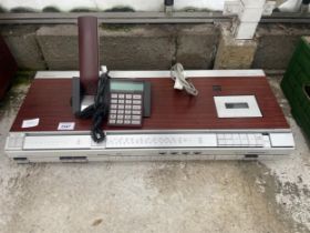 A BANG AND OULFSEN BEOCENTER 2600 STEREO AND A BANG AND OULFSEN BEOCOM 2400 TELEPHONE