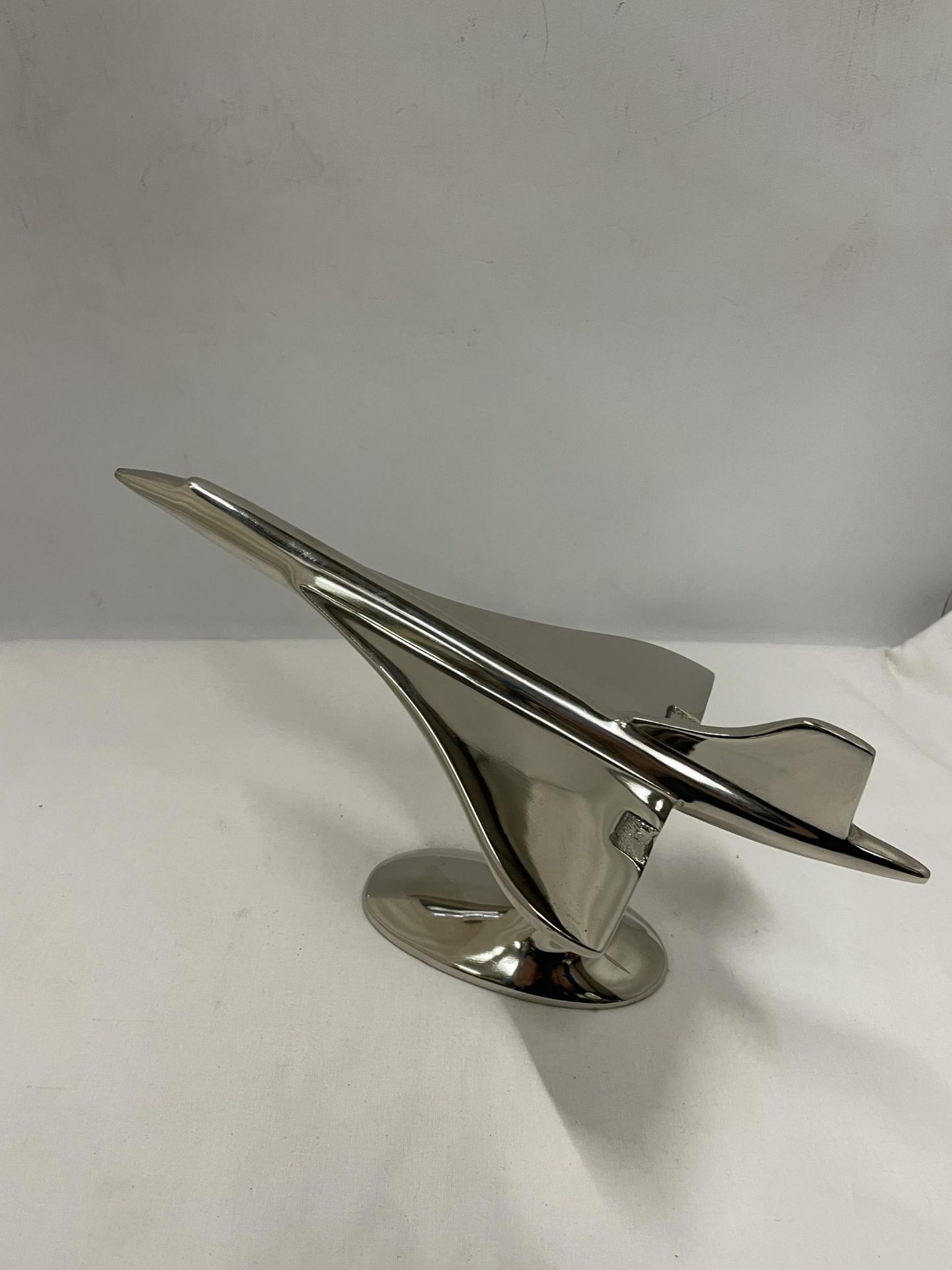 A CHROME CONCORDE ON A STAND