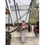 A HONDA GXV120 PETROL TWO WHEELED PUSH ALONG GRASS STRIMMER