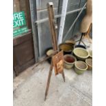 A WOODEN ARTISTS EASEL AND TWO WOODEN BOARD PRINTS