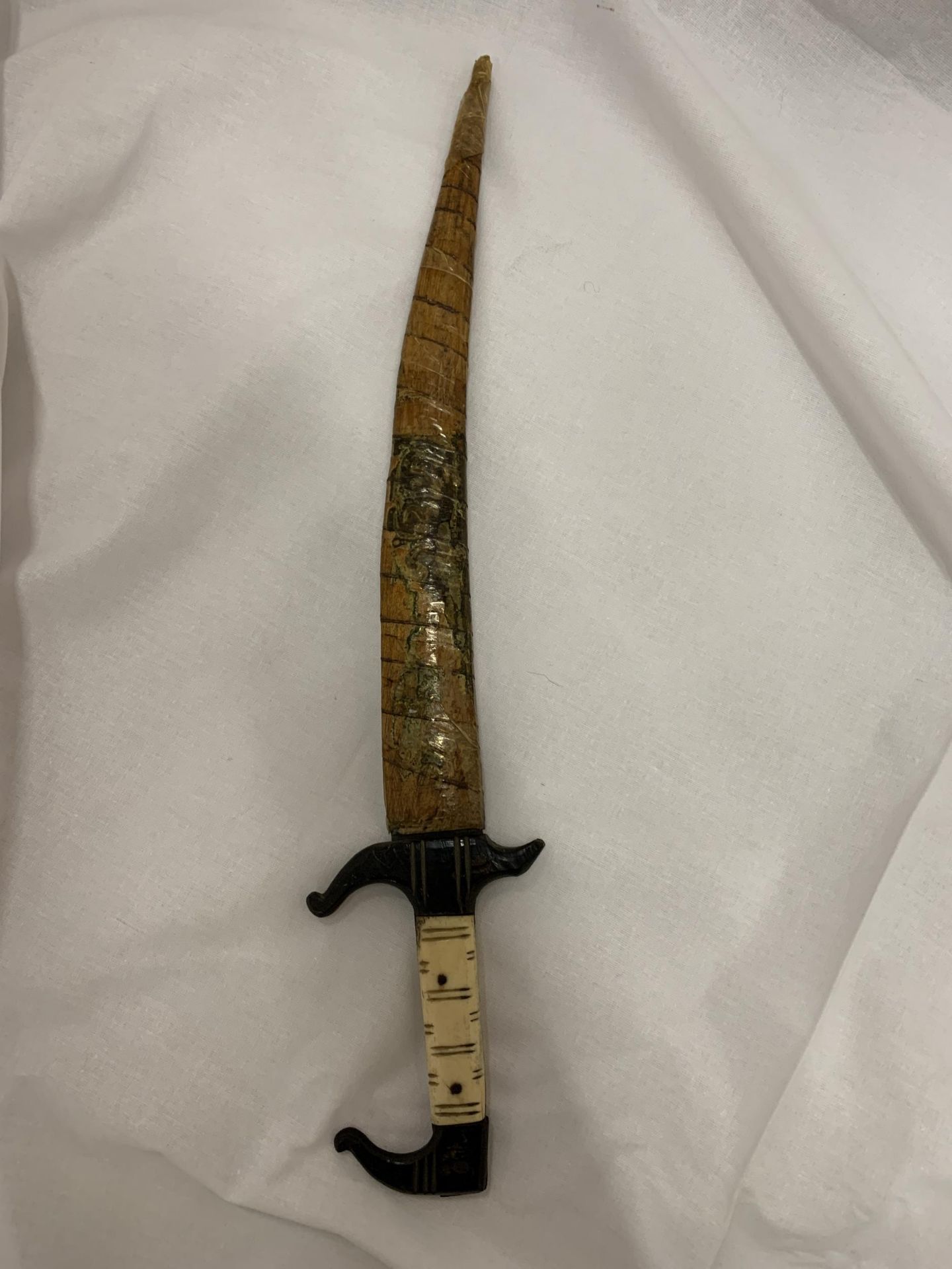 A VINTAGE MIDDLE EASTERN ISLAMIC DAGGER WITH BONE HANDLE