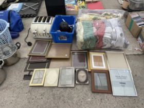 AN ASSORTMENT OF ITEMS TO INCLUDE PICTURE FRAMES AND A TOASTER ETC