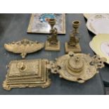THREE ORNATE VINTAGE BRASS INKWELLS TOGETHER WITH A PAIR OF GRIFFIN DESIGN CANDLESTICKS