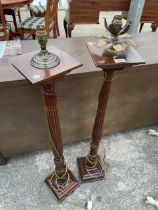 A PAIR OF 19TH CENTURY STYLE TALL LAMPS ON TURNED AND FLUTED COLUMNS ON STEPPED BASE