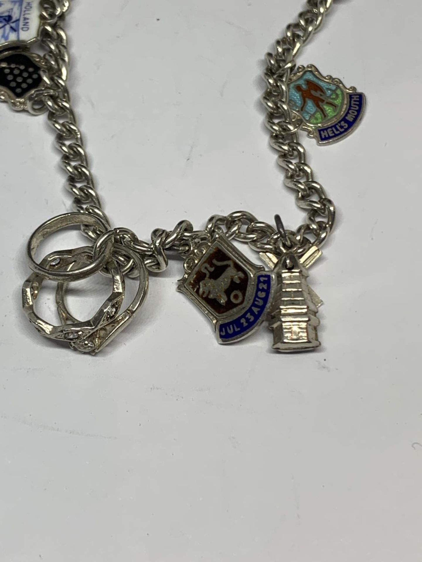 A SILVER CHARM BRACELET WITH SEVEN CHARMS - Image 3 of 3