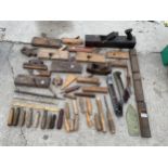 A LARGE ASSORTMENT OF VINTAGE WOOD PLANES AND WOODEN CHISEL HANDLES ETC