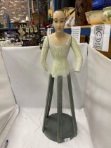 AN UNUSUAL PAINTED WOODEN DOLL ON STAND WITH MOVEABLE ARMS