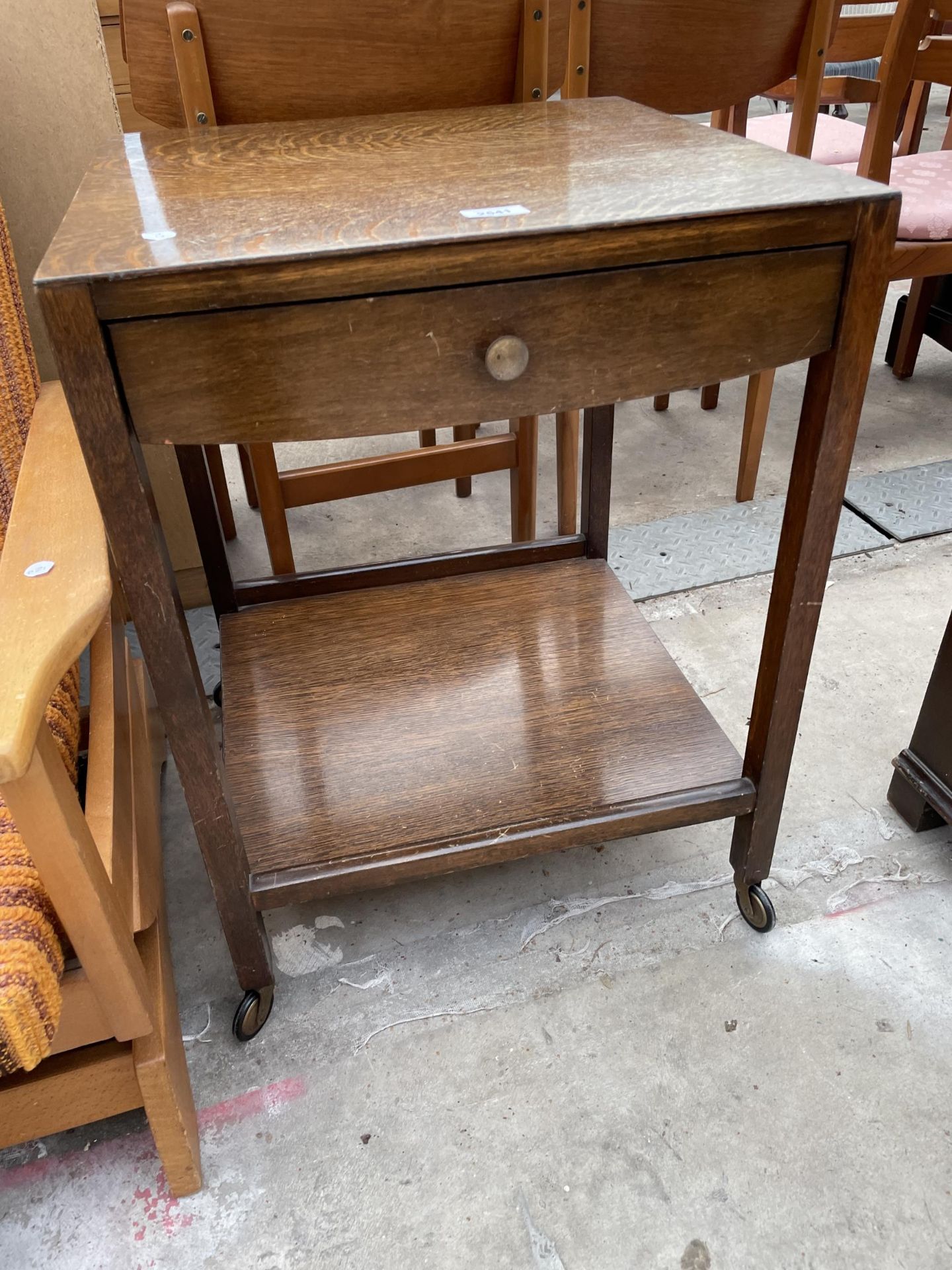 A MID 20TH CENTURY OAK TWO TIER OCCASIONAL TABLE AND FIRESIDE ROCKING CHAIR - Image 2 of 3