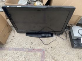 AN HITACHI 32" TELEVISION WITH REMOTE CONTROL