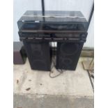 AN HITACHI STEREO MUSIC CENTRE AND A PAIR OF LARGE YAMAHA SPEAKERS