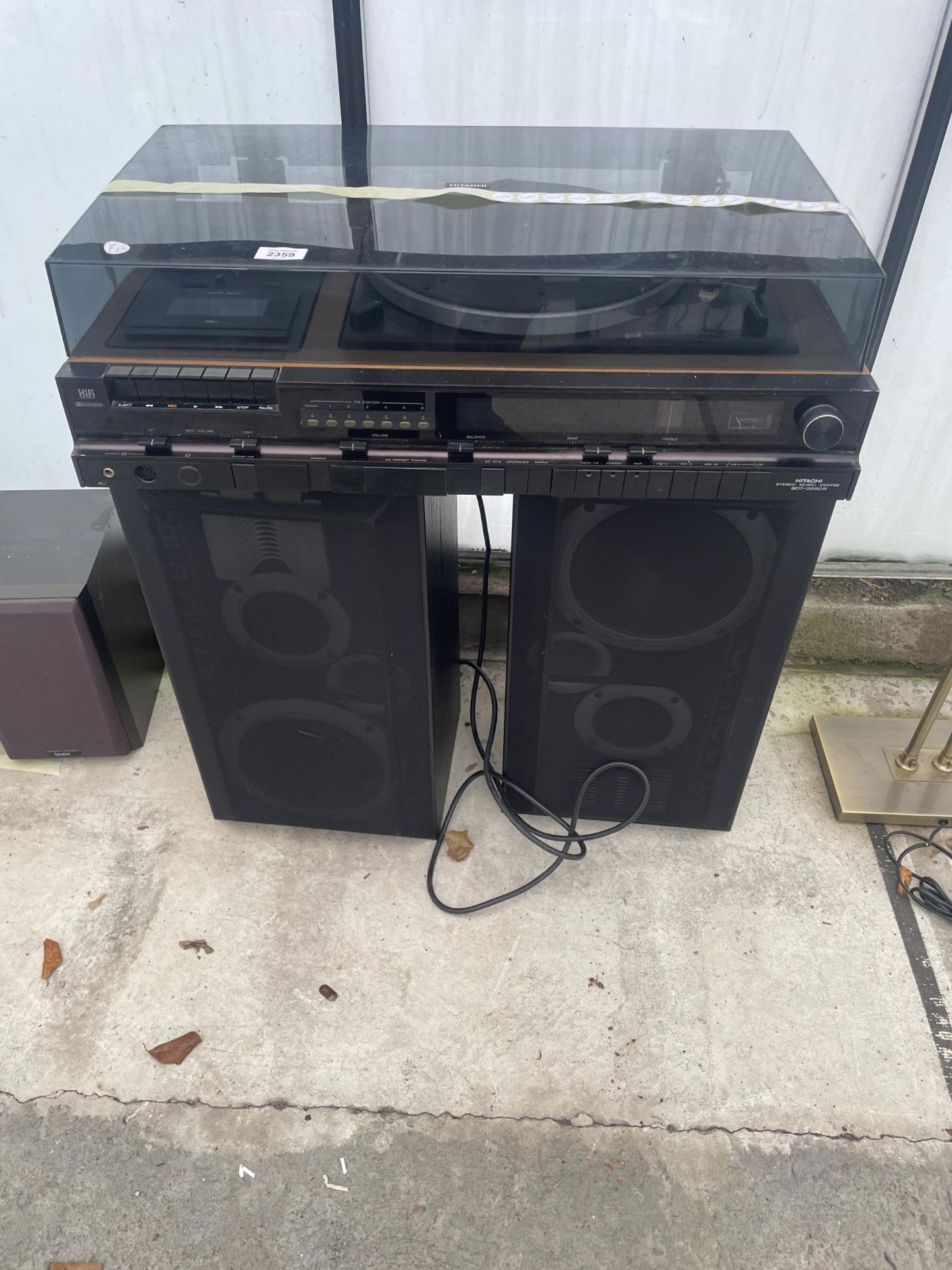 AN HITACHI STEREO MUSIC CENTRE AND A PAIR OF LARGE YAMAHA SPEAKERS