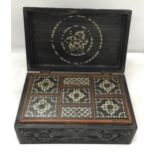 A VINTAGE CARVED DARK OAK JEWELLERY BOX WITH INNER SECTION WITH INLAID COMPARTMENT LIDS