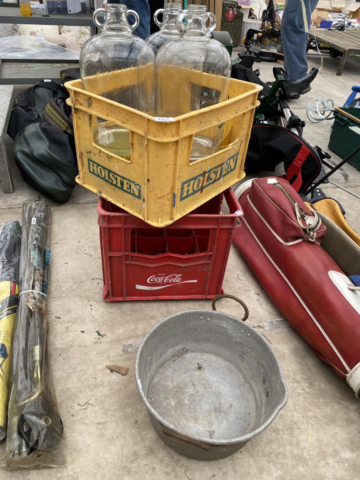 AN ALLOY JAM PAN, TWO BRANDED BOTTLE CRATES AND THREE GLASS DEMI JOHNS