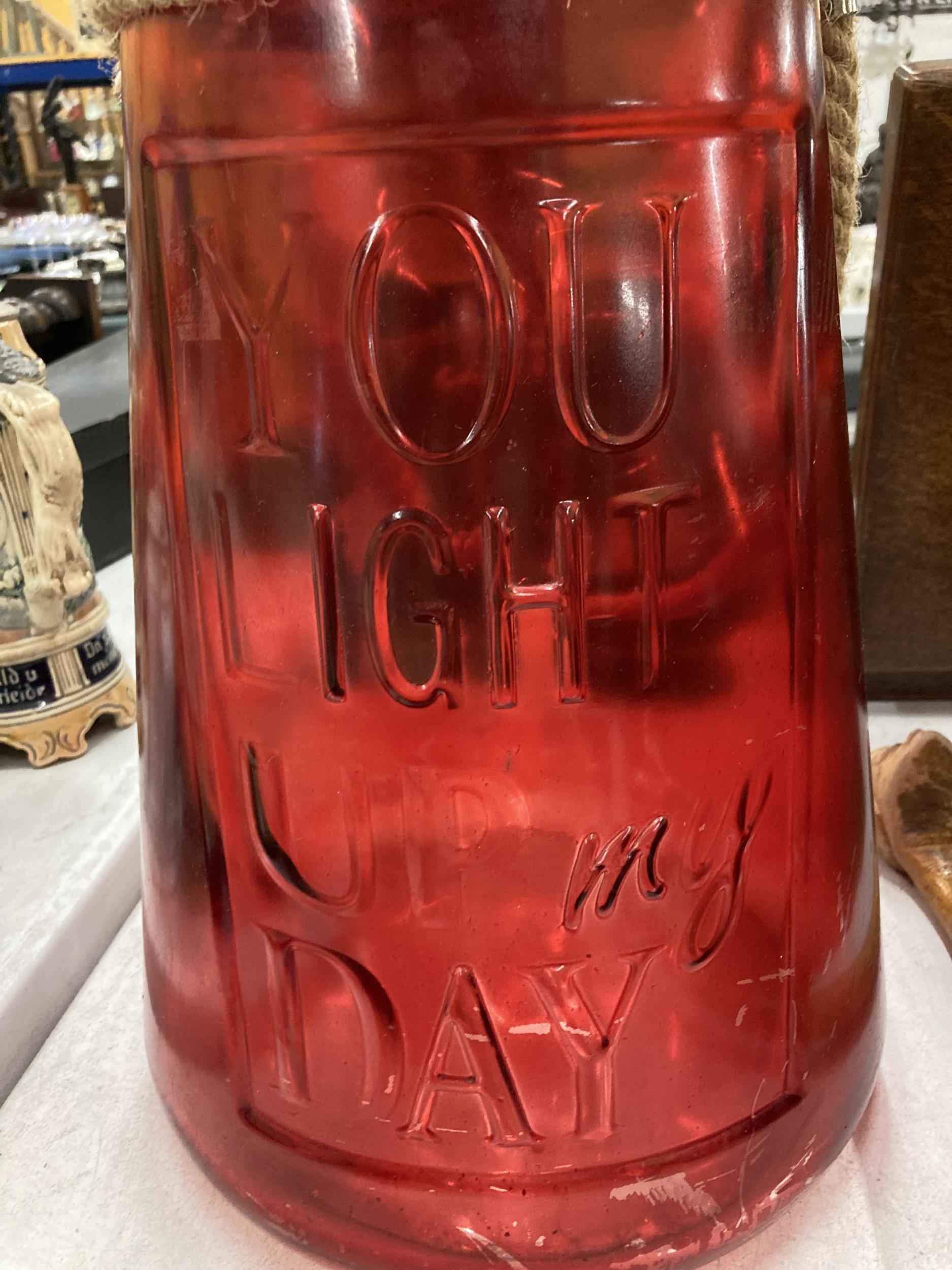 A LARGE RED GLASS YOU LIGHT UP MY DAY URN - Image 2 of 3