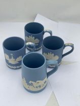 A GROUP OF FOUR WEDGWOOD PALE BLUE JASPERWARE MUGS