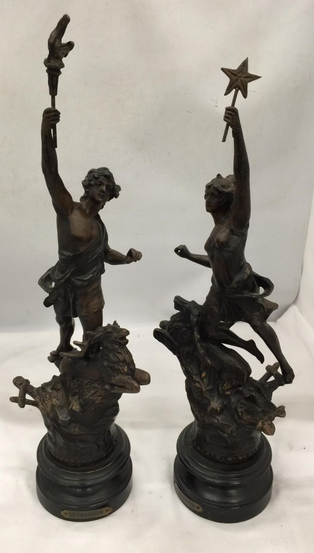 A PAIR OF VINTAGE FRENCH SPELTER CLASSICAL FIGURES TITLED 'LE CHASSEUR' AND 'LA CHASSERESSE'