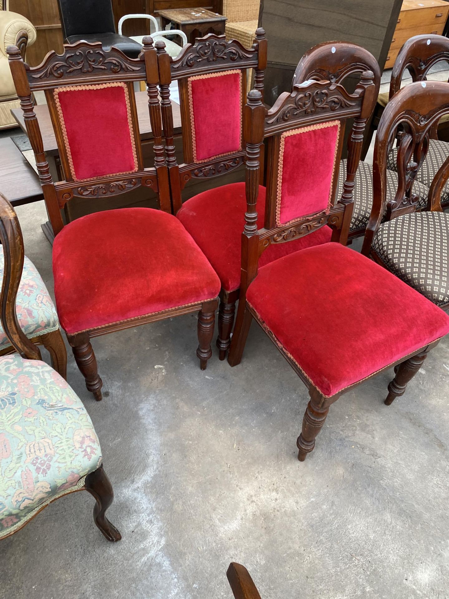 THREE VICTORIAN MAHOGANY DINING CHAIRS WITH CARVED BACK RAILS AND THREE BALLOON BACK CHAIRS - Image 3 of 4