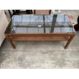 A RETRO TEAK TWO TIER COFFEE TABLE WITH INSET SMOKED GLASS TOP, 34 X 17"