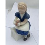 A ROYAL COPENHAGEN FIGURE OF A GIRL ON A BENCH, NO. 473