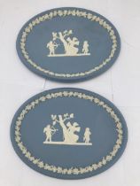 A PAIR OF WEDGWOOD PALE BLUE JASPERWARE CUPID OVAL TRAYS