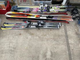 FIVE PAIRS OF SKJIS AND A SNOW BOARD