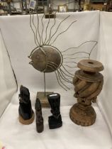 A COLLECTION OF CARVED TREEN ITEMS TO INCLUDE AFRICAN SSTYLE BUSTS, A LARGE POSSIBLE LAMP BASE AND A