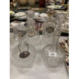 FOUR VINTAGE CUT GLASS DECANTERS WITH THREE DECANTER LABELS - TWO BEING SILVER PLATE