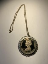 A SILVER JUBILEE COIN AND SILVER NECKLACE