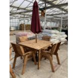 AN AS NEW EX DISPLAY CHARLES TAYLOR FOUR SEATER TABLE WITH FOUR CHAIRS, A PARASOL WITH BASE + VAT