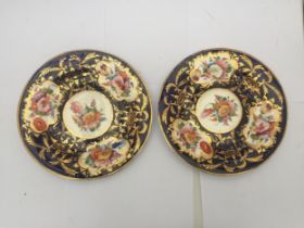 A PAIR OF 19TH CENTURY PORCELAIN BLUE AND GILT HAND PAINTED PLATES
