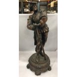 A LARGE BRONZE EFFECT SPELTER FIGURE OF A 16TH CENTURY ITALIAN MUSKETEER ON PEDESTAL, 30" HEIGHT