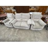 A MODERN GREY G.PLAN THREE PIECE SUITE COMPRISING TWO SEATER SETTEE AND TWO EASY CHAIRS