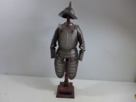 A MINIATURE REPLICA SUIT OF 17TH CENTURY ARMOUR ON A WOODEN STAND, HEIGHT 56CM
