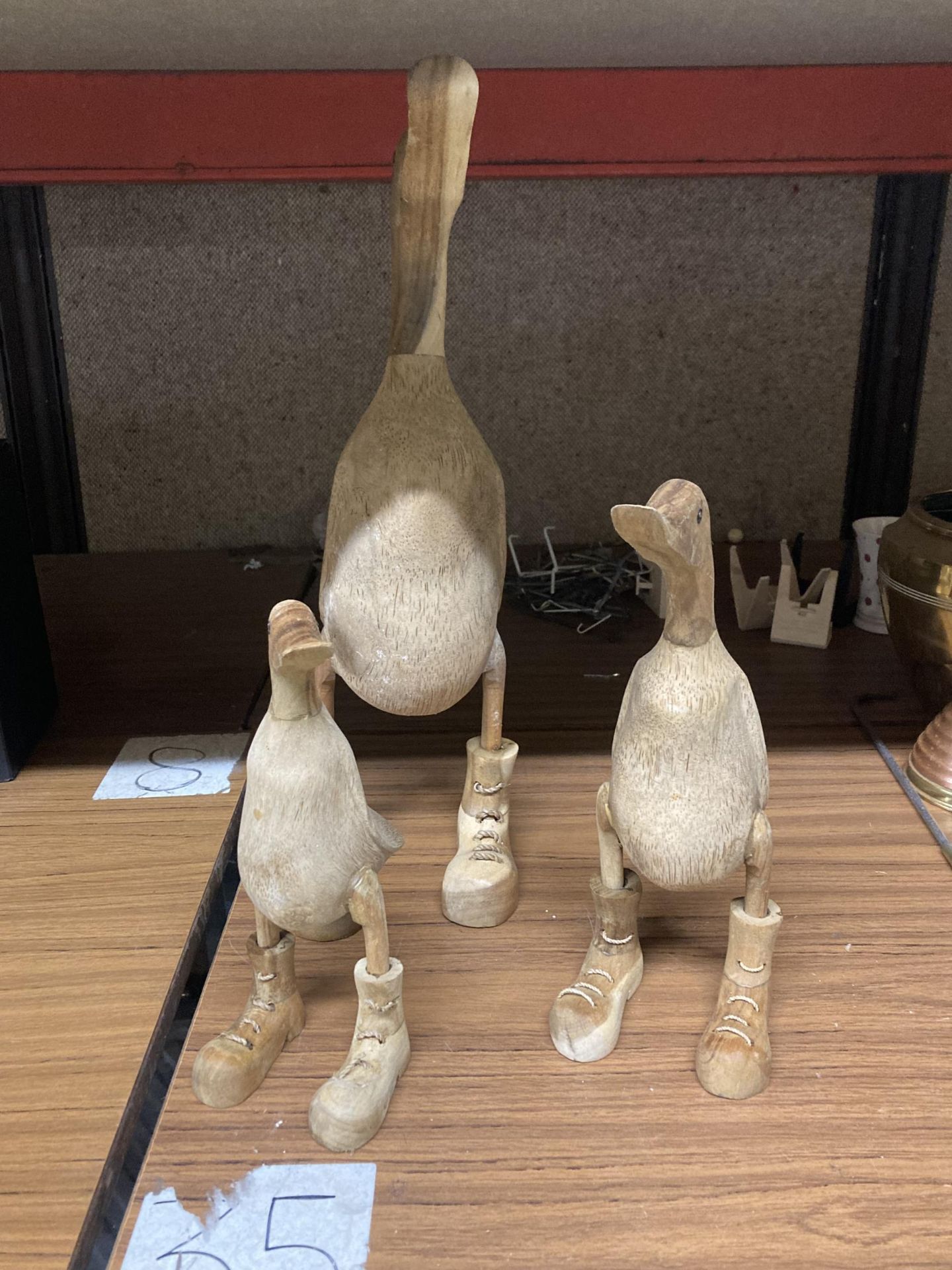 A GROUP OF THREE WOODEN DUCK FIGURES