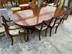 A MAHOGANY REGENCY STYLE TWIN PEDESTAL EXTENDING DINING TABLE, 64 X 39" (LEAF 20") AND SIX ROPE BACK